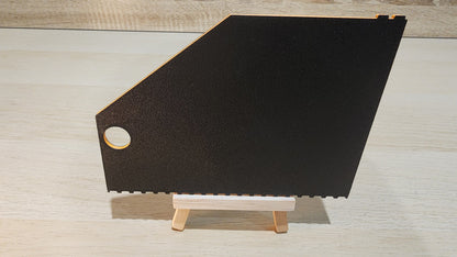Black and orrange brick ruler showing the back view.
