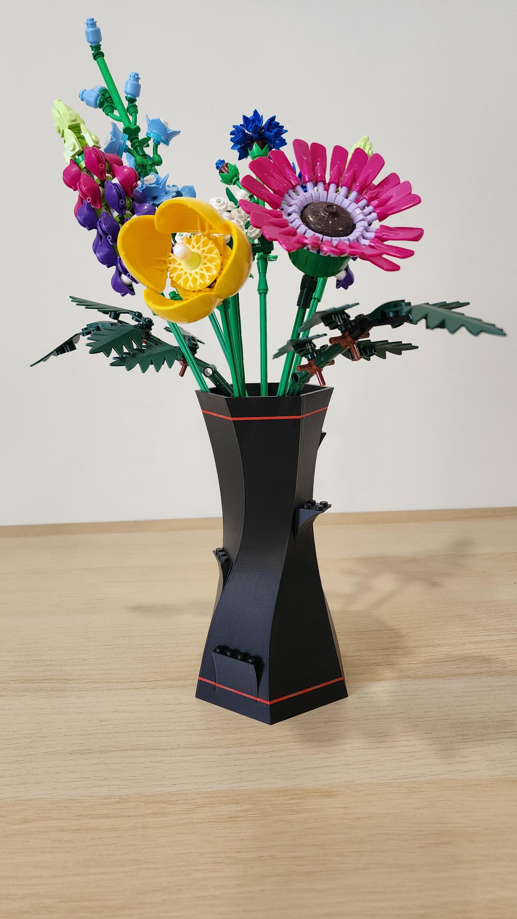 Black and Red LEGO-Compatible Vase with multicoloured LEGO flower bouquet including daisies and sunflowers