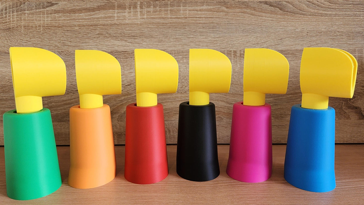Lineup of Minifig-Inspired Headphone Holders in multiple colours on wood background